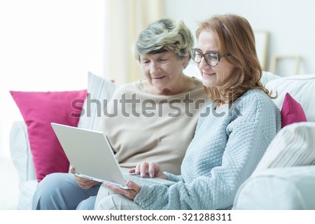 Elder friends are using a modern technology