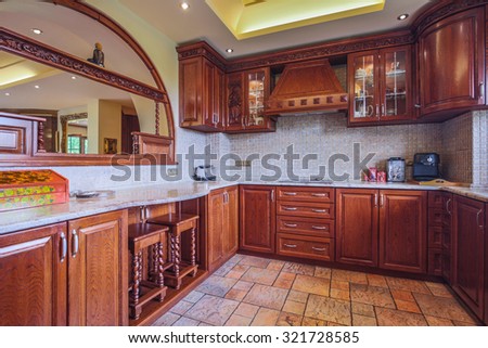 Photo of spacious wooden kitchen interior neat furnished