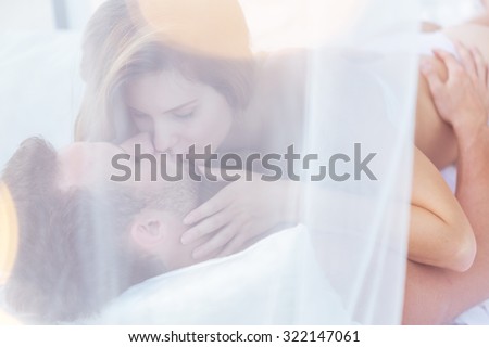 Picture of couple kissing in sexual position