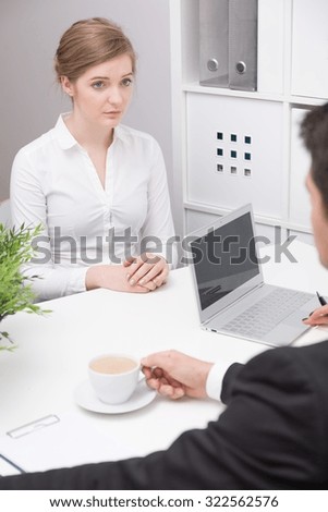 Young stressed woman on first job interview