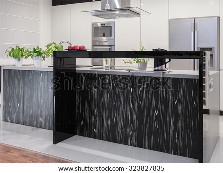 Photo of new kitchen with decorative black and white worktop