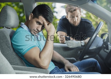 Worried young driver caught on driving after alcohol