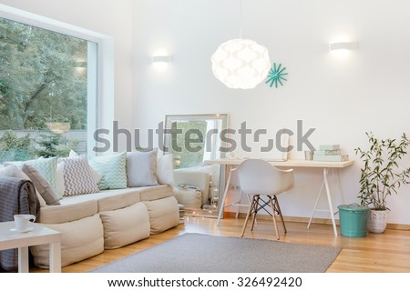 Horizontal picture of bright living room arrangement