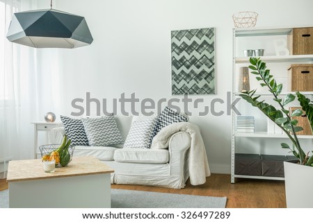 Very bright living room with white furniture