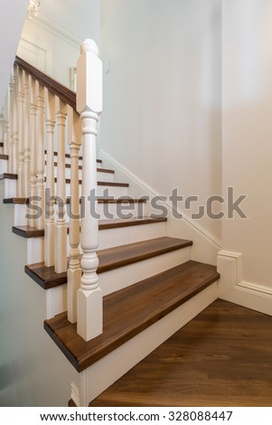 Close up of beautiful solid wooden stairs with railing