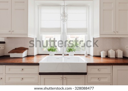 Picture of elegant kitchen furniture with solid wooden worktops