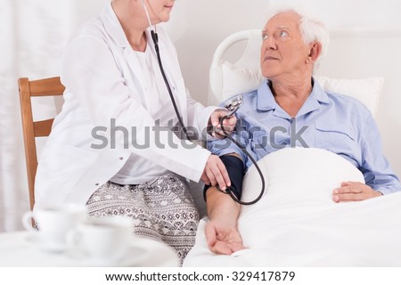 Old and ill man has very high blood pressure
