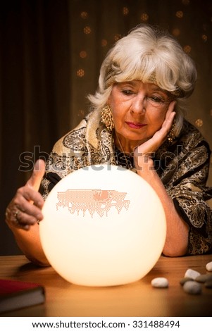 Portrait of fortune teller with crystal ball