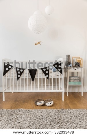 Photo of white wooden crib in kid room