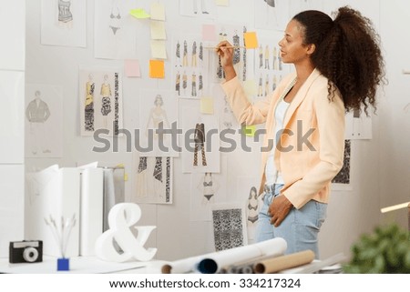 Image of fashion designer working in atelier