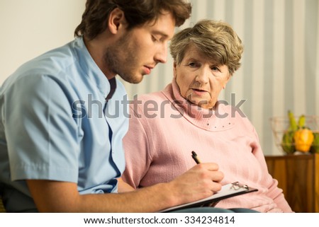 Picture of male doctor and elder woman