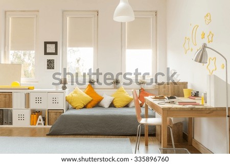 Light cozy teen room with color decorations