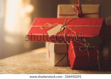 Gifts wrapped in red and brown ecological paper