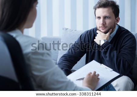 Young man during therapy at psychologist\'s office