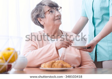 Picture of senior woman drinking tea for indigestion