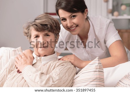 Image of elderly woman having professional medical care