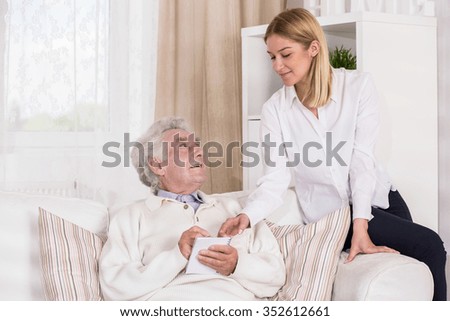 Image of granddaughter with ill old grandfather