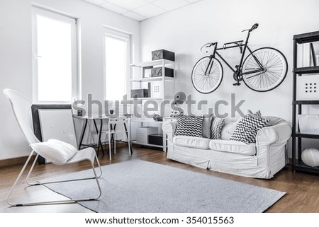 Black and white studio room of young hipster