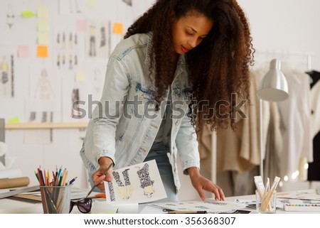 Picture of fashion designer during work at agency