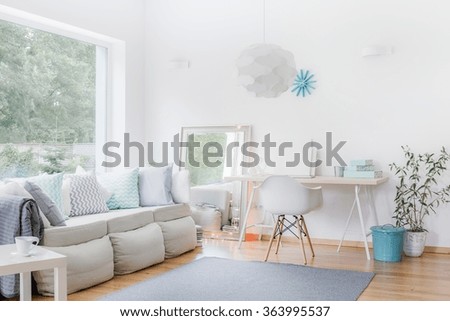 Image of spacious apartment in modern style with light furniture