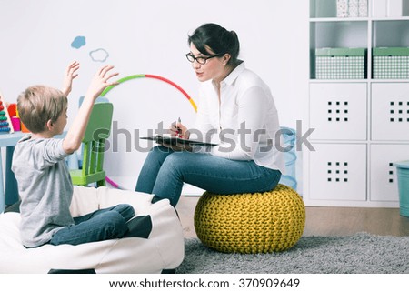 Boy and young woman teacher during private home lesson