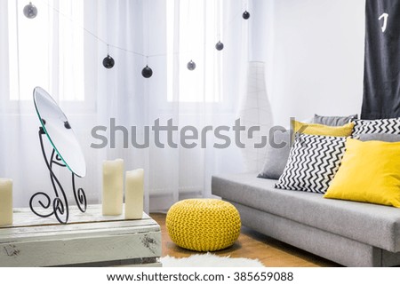 Image of a grey and yellow living room