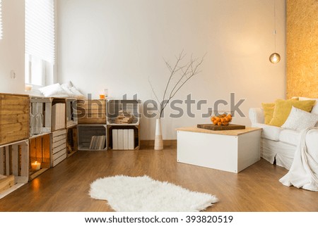 Modern living room with handmade bookcase, flooring, sofa and table