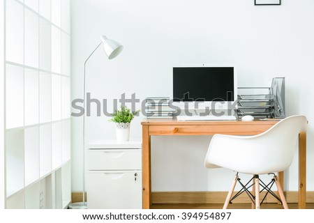 Study room in white with modern, simple furniture