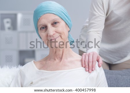 Sick older woman with cancer with inner strength to fight with disease