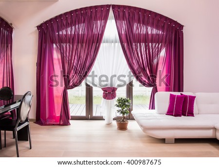 Big window with elegant drapes and curtain