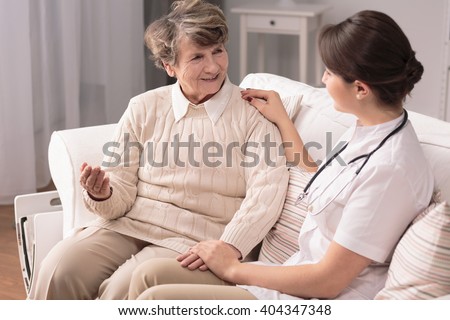Older friendly woman and her nice young carer