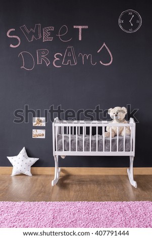 Shot of a creative baby room with a chalkboard wall