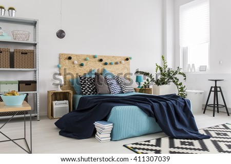 Shot of a bed in a spacious modern bedroom