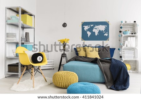Shot of a modern yellow and blue bedroom