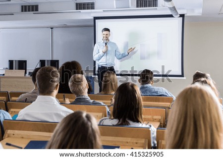 Image of a teacher giving a lecture to his students