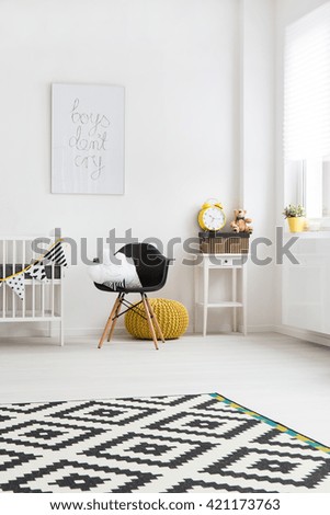 Shot of a corner of a bright baby room with chair in the centre
