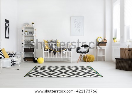 Spacious baby room with bright windows and scandinavian furniture