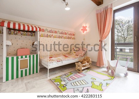 Shot of a spacious pink nursery room
