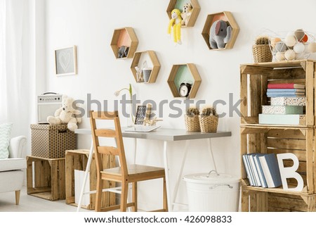 Shot of a modern children\'s room full of wooden furniture