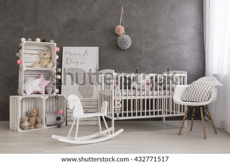 Shot of a cozy baby girl nursery room
