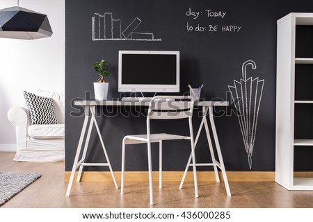 Minimalist white little home office with trendy blackboard wall