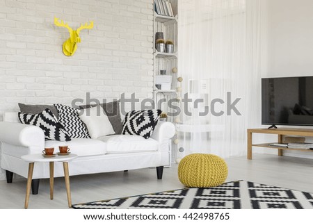 Shot of a cozy creative room with yellow accessories