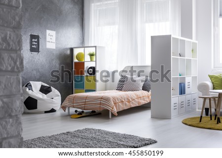 Shot of a yout room with a living room combined with sleeping area