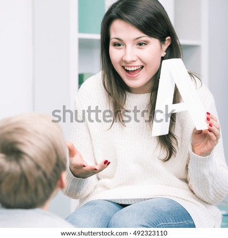Shot of a speech therapist and a little boy