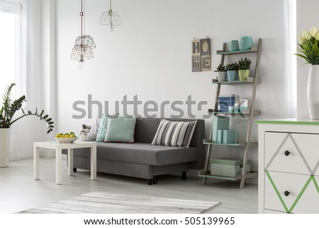 Shot of a comfortable living room interior with stylish pendant lamps