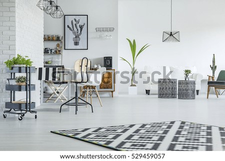 White flat with dining area and living room combined