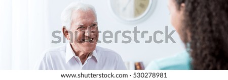 Elder man is spending happy time with his company