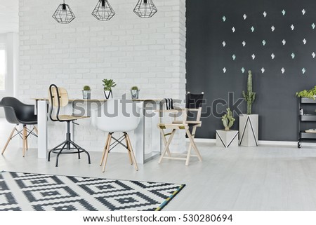 Dining room with chalkboard and decorative brick wall