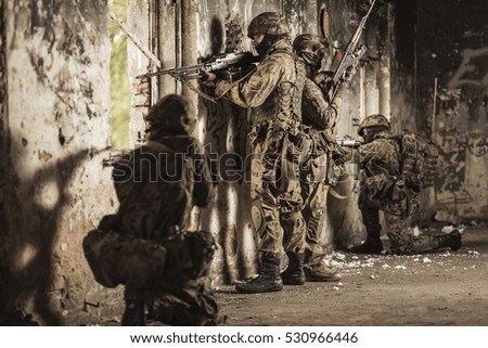 Young soldiers and snipers with heavy automatic weapon
