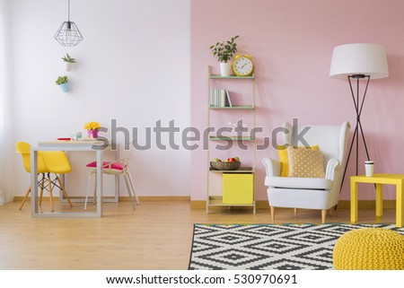 Pink living room with white and yellow furniture